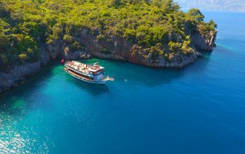 Touristic boat trips in the Gokova Bay which is located in Aegean Sea side of Turkey, turquoise sea and aerial view from the top in Marmaris/Mugla